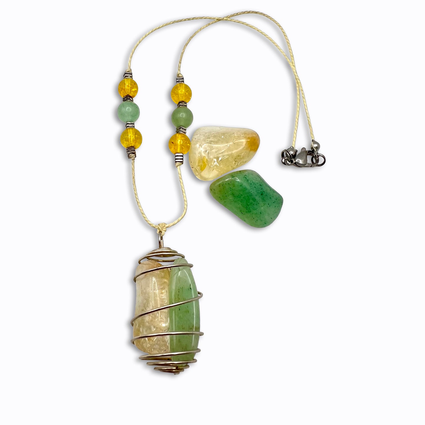 Necklace with green and yellow stone beads on a white background