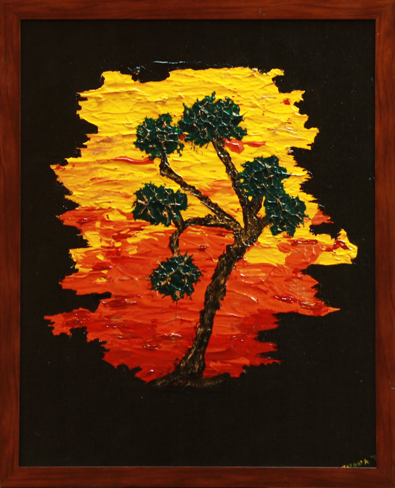 Painting of a tree with a sunset background in a wooden frame