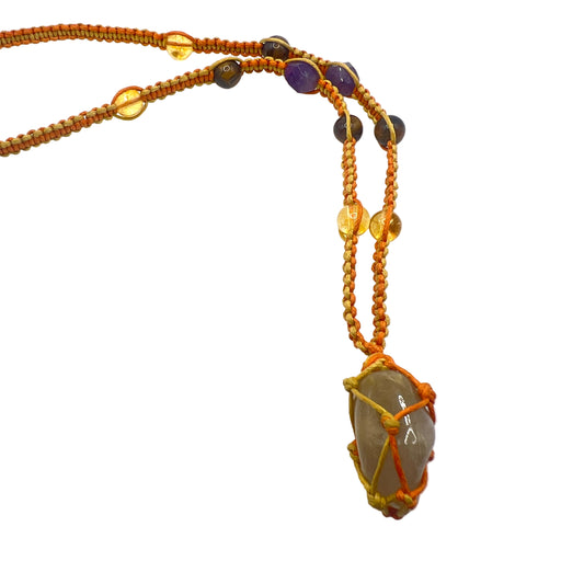 Handcrafted crystal necklace featuring amethyst, tiger eye, citrine, and rutilated quartz. A unique energy piece for abundance, clarity, and protection—perfect for everyday wear or meaningful gifting.