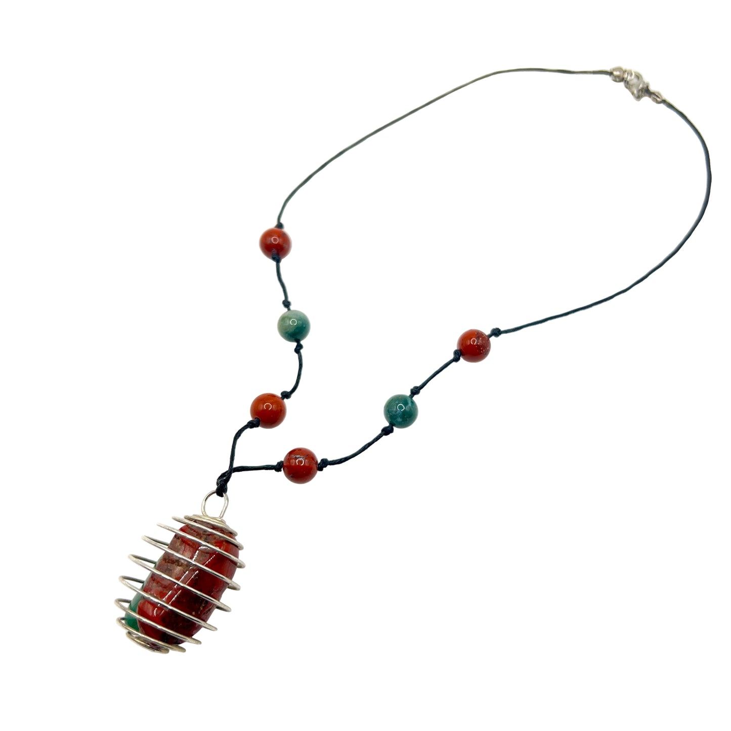 Handmade Necklace with crystal and a unique pendant on a white background