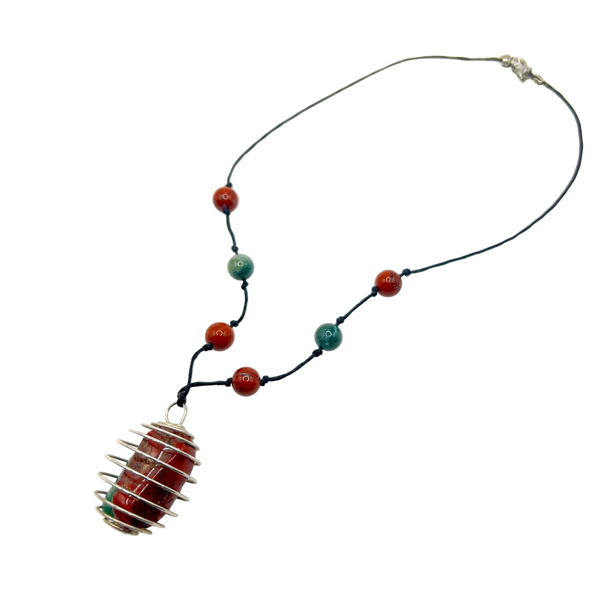 Handmade Necklace with crystal and a unique pendant on a white background
